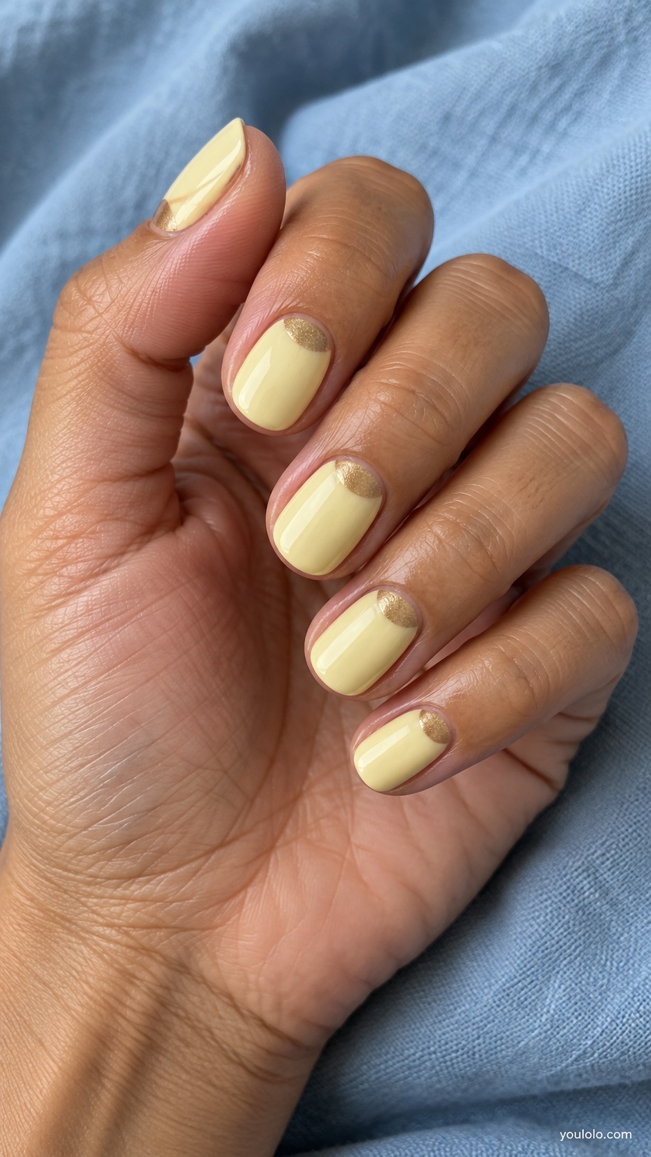 Short oval nails pale lemon cream with muted honey gold half moons