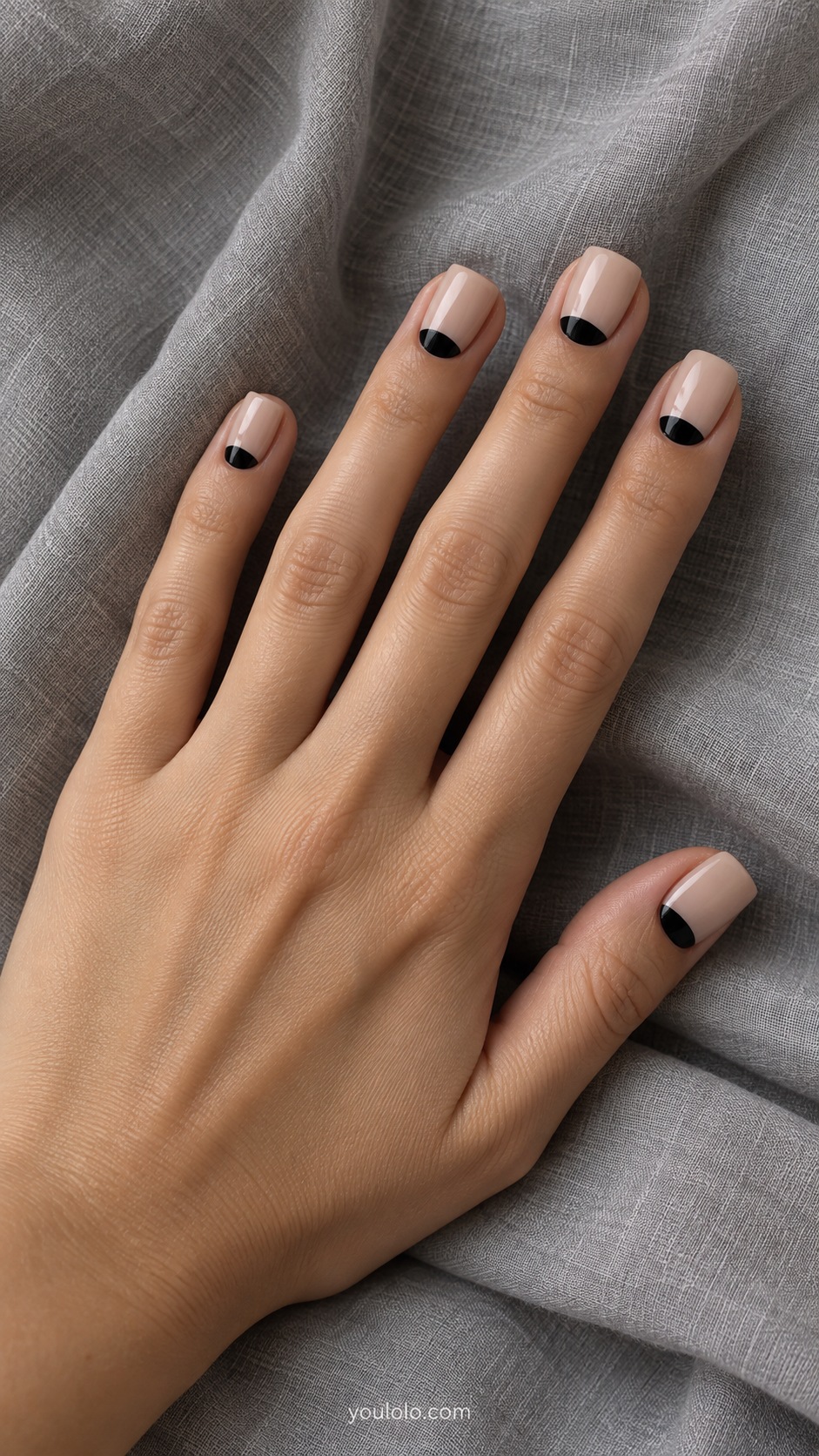 Short square acrylic overlay nails sheer beige with crisp black half moons at cuticles gloss