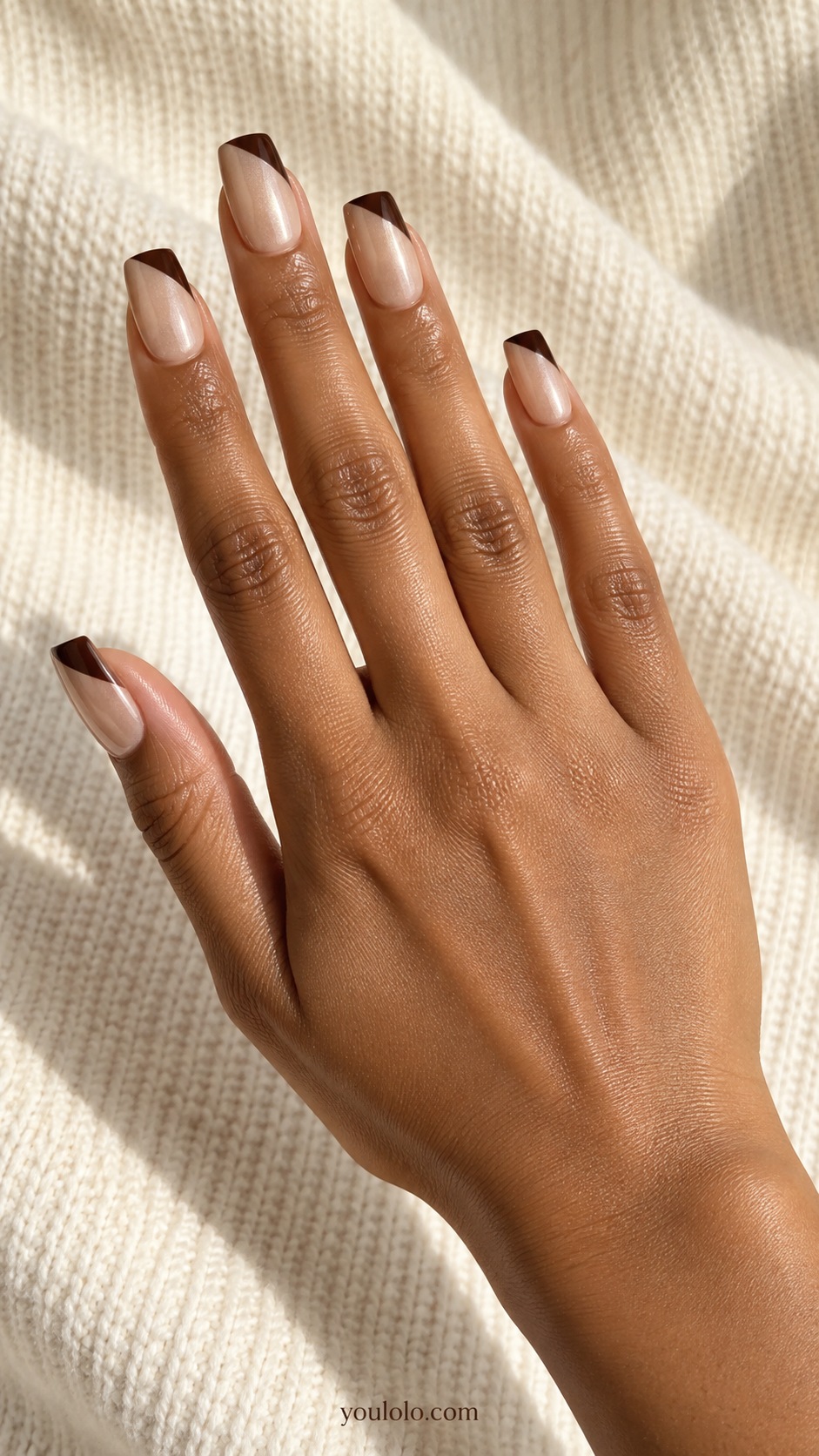 Medium square nude beige pearl nails diagonal dark chocolate glazed french tips with crisp slanted boundary