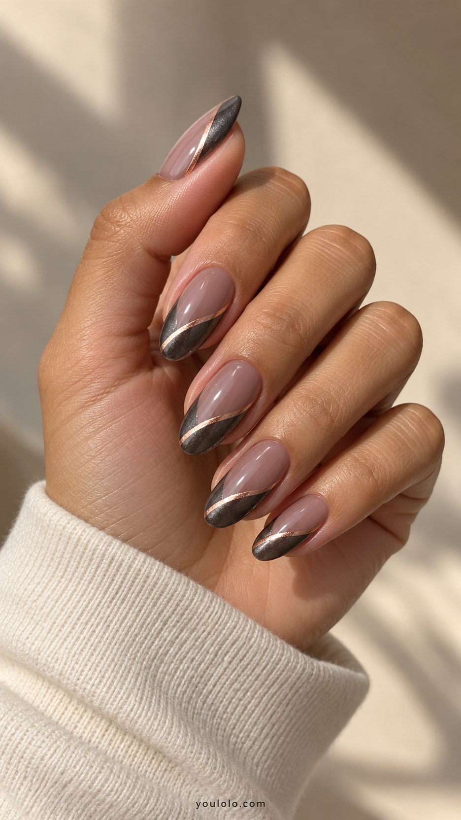 Gunmetal and Rose Gold: medium almond smoky nude nails, gunmetal side sweep with thin rose gold divider