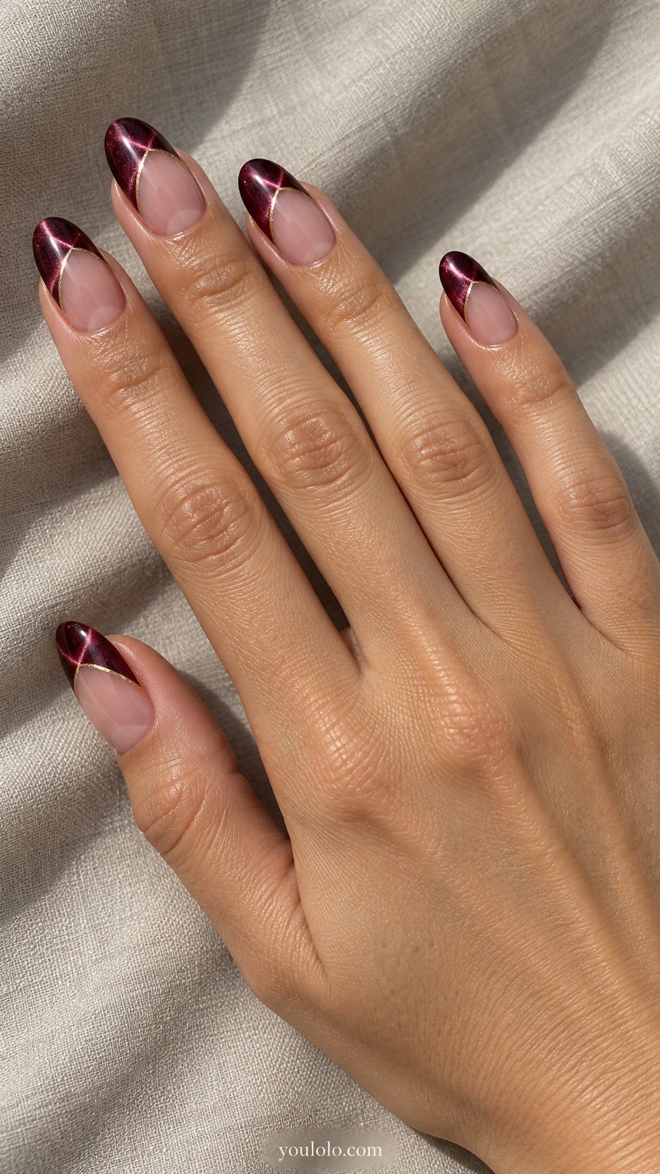 French Cat Eye Nails: medium oval nude beds burgundy magnetic tips hairline gold smile outline