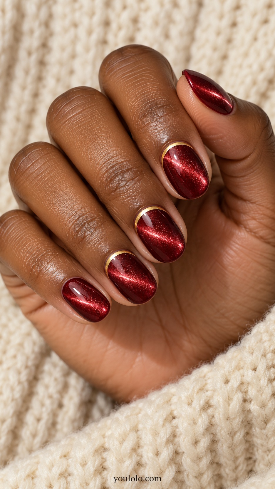 Short Red Cat Eye Nails: short oval ruby magnetic nails fine gold shallow arc near base on two accents