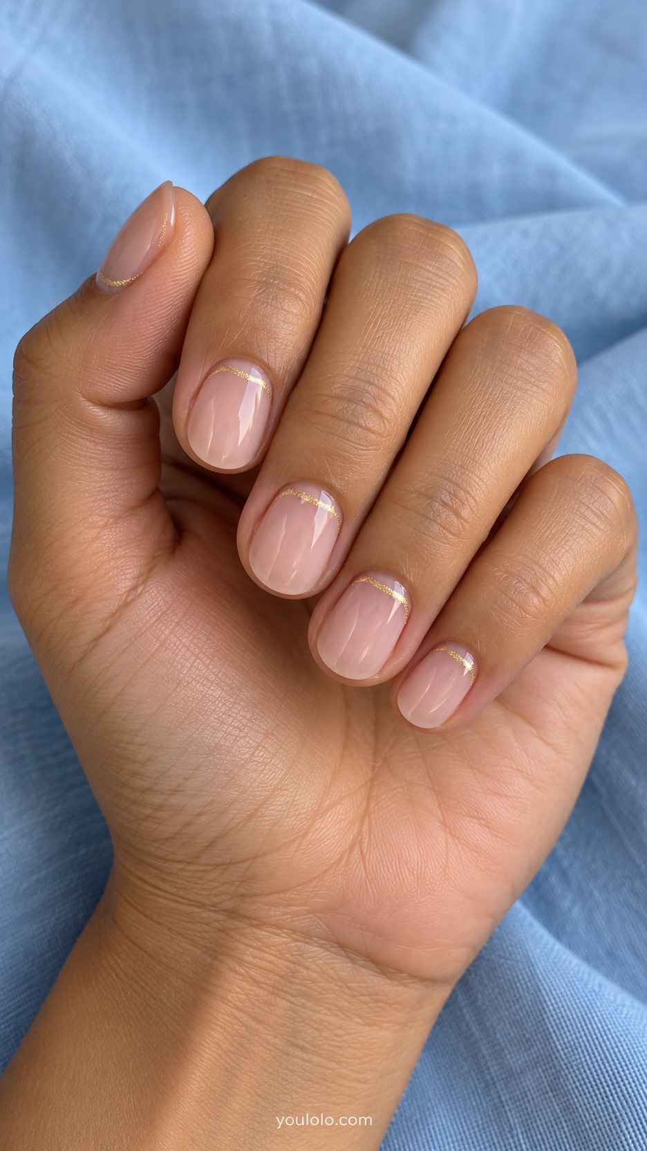 Short Wedding Nails: Champagne Cuticle Halo manicure on a naturally posed hand