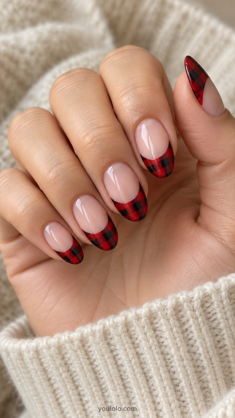Nude oval nails with deep curved red-and-black checked French tips