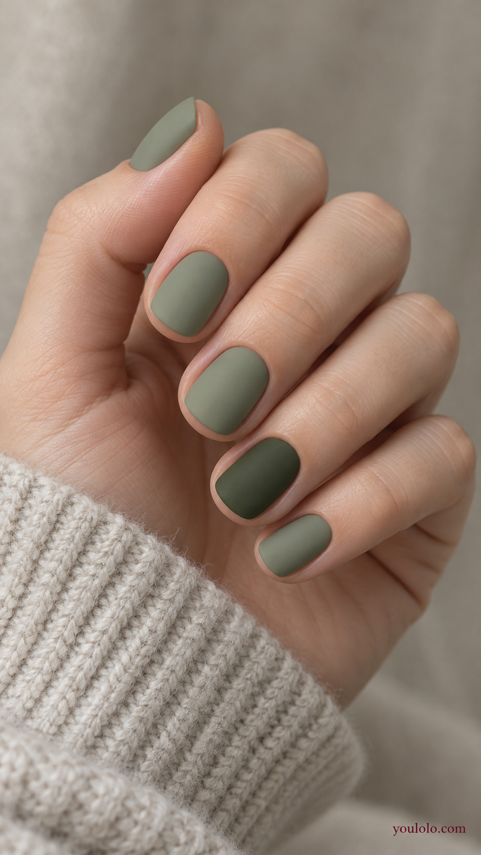 Muted Sage with a Moss Accent on a softly gathered feminine hand with a matte green manicure