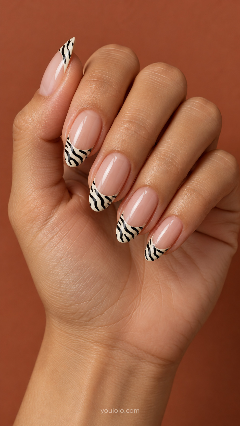 Zebra Stripe French on oval nails with a nude base