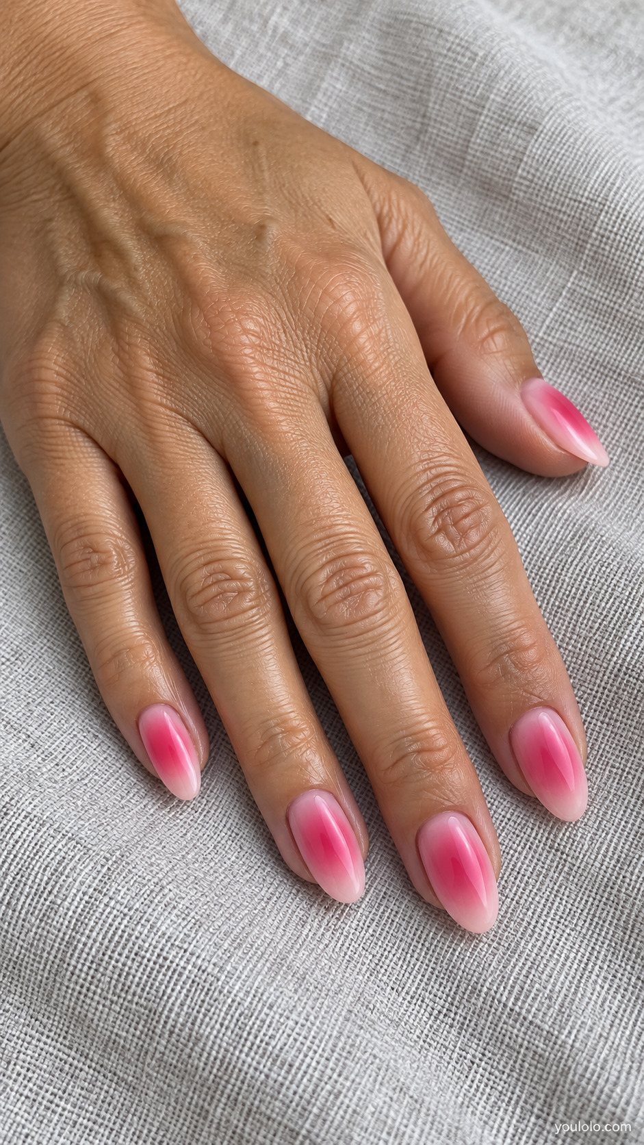 Pink almond nails with diffused raspberry centers and pale edges