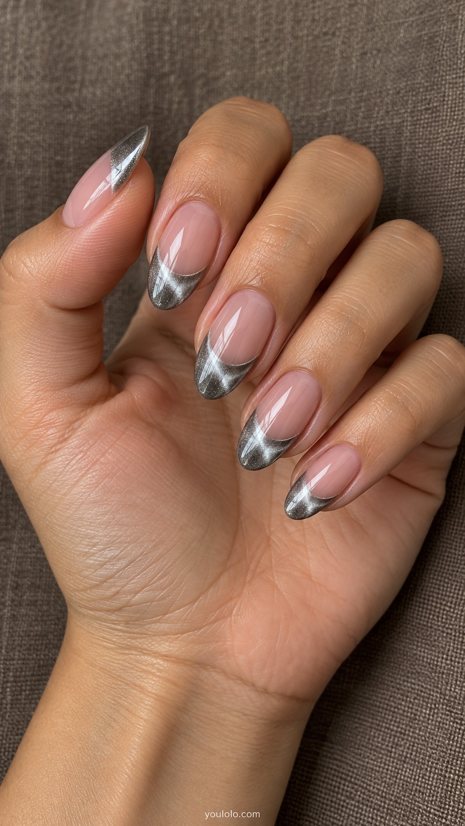Silver Deep French cat eye nails — Medium almond sheer neutral pink nails with wide silver magnetic cat eye French tips.