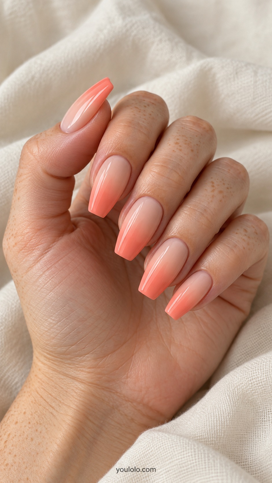 Medium coffin acrylic extensions soft smooth gradient pale peach cuticles to richer coral peach tips gloss