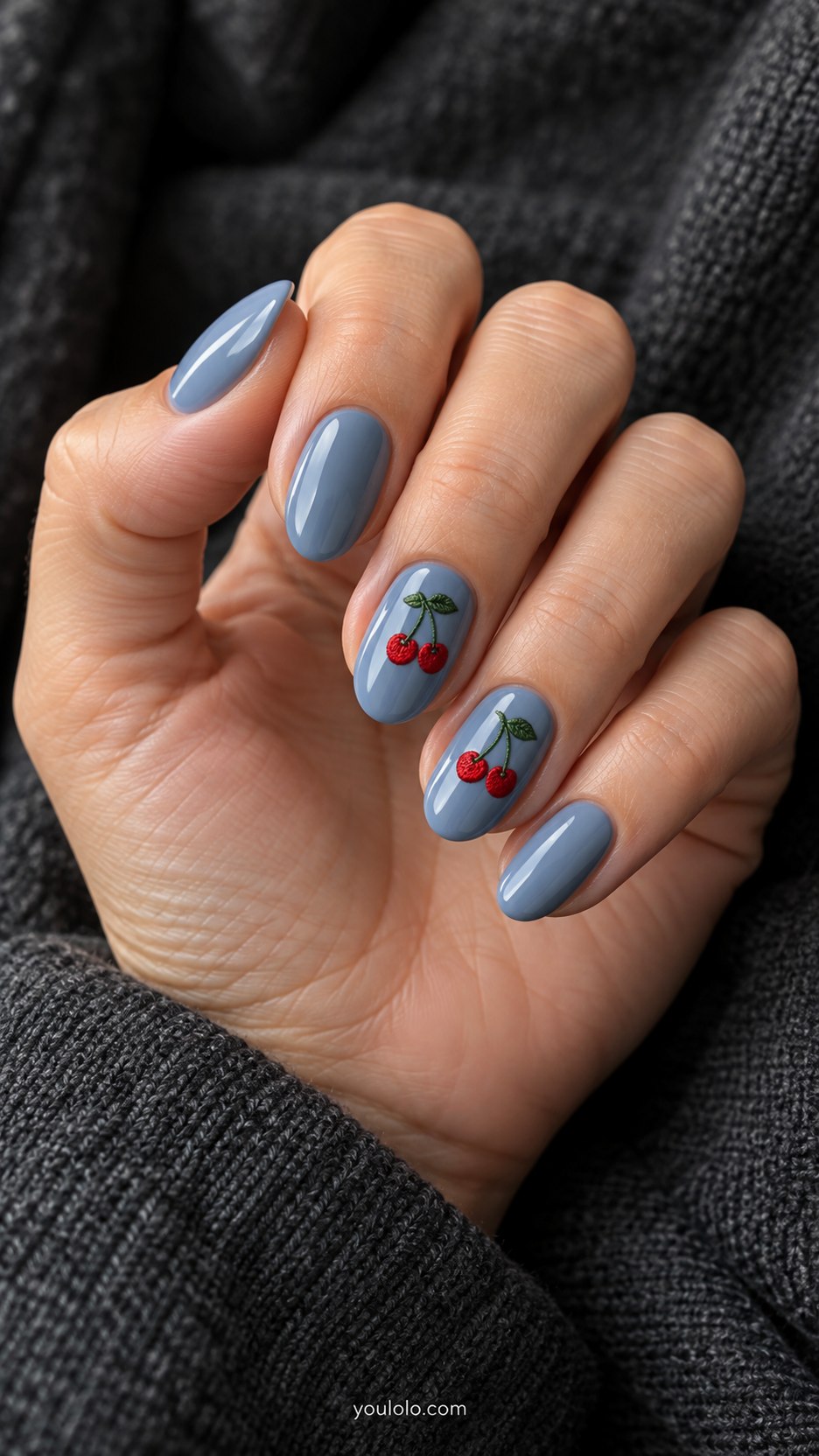 Cherry-Red Denim Detail: medium oval faded blue nails, tiny flat red embroidered-style cherry motifs on two accents