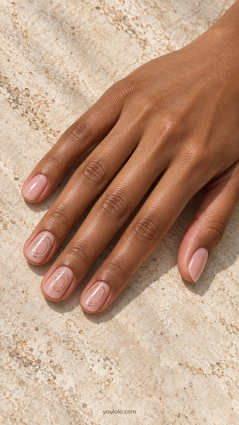 Two-Metal Orbit Rings: short round clear pink nails, two fine flat overlapping oval rings gold and silver on two accents