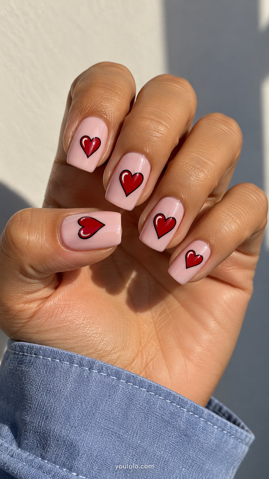 Cherry Comic Hearts: medium square pale pink nails, red black-outlined hearts with single white painted highlight
