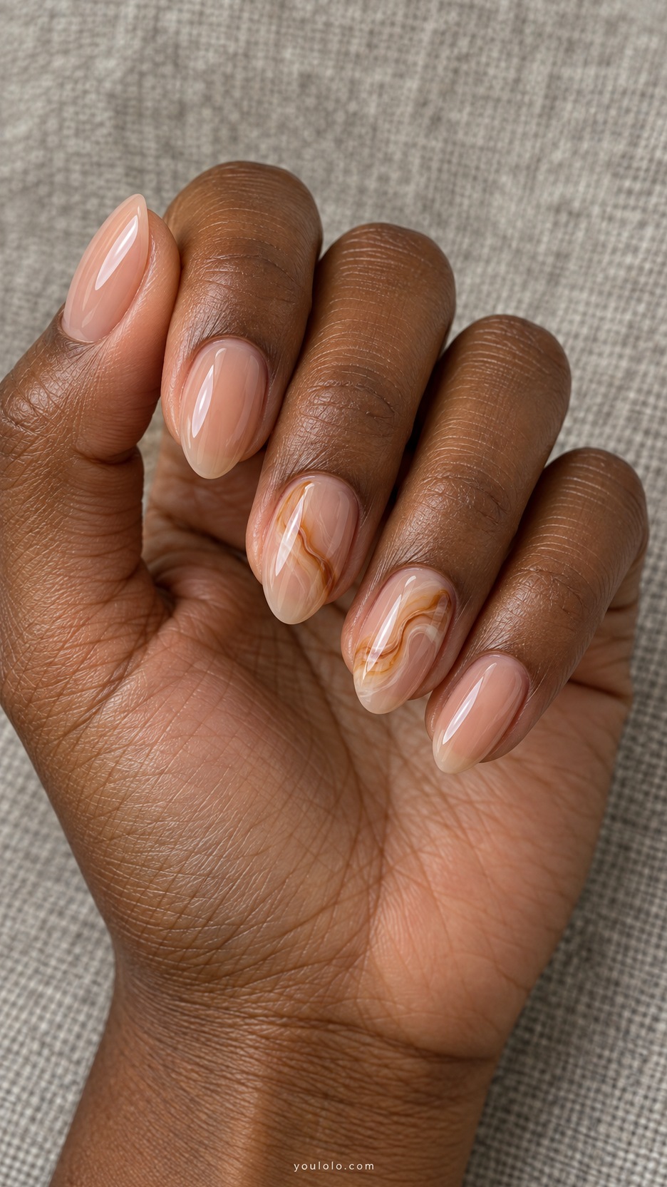 Short Almond Nail Designs: Honey Marble Ribbon manicure on a naturally posed hand