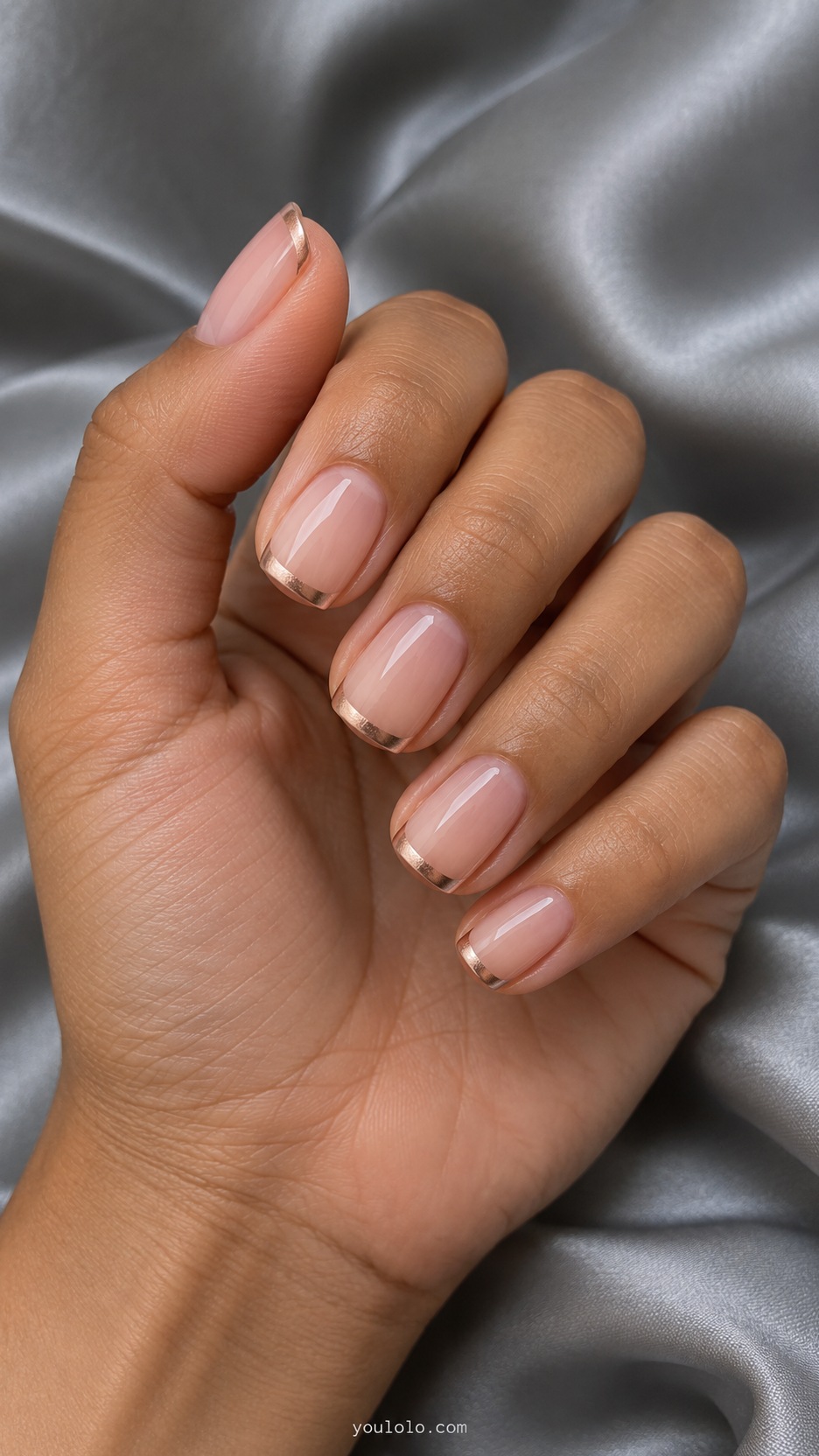 Short Press-On Nails: Rose Gold Edge manicure on a naturally posed hand