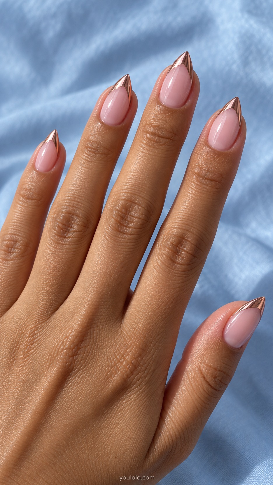 Short Stiletto French Nails: Rose Chrome Edges manicure on a naturally posed hand