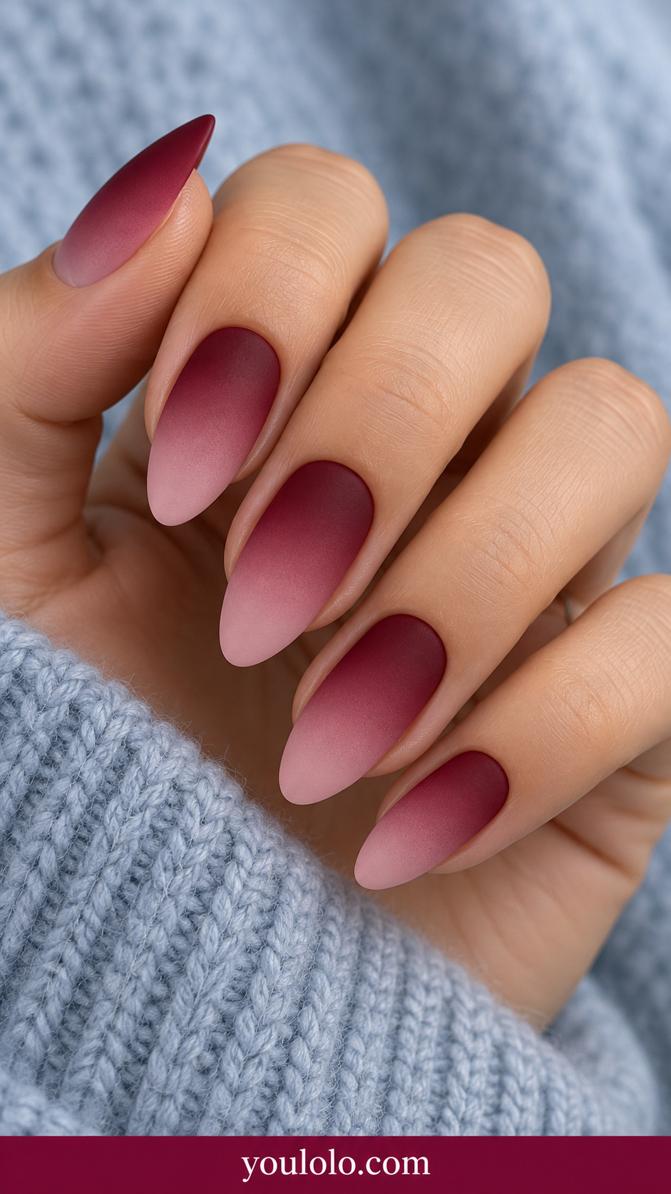 medium almond smooth ombre from deep cranberry at cuticle to pale rose at tips, no other art on a naturally relaxed adult hand