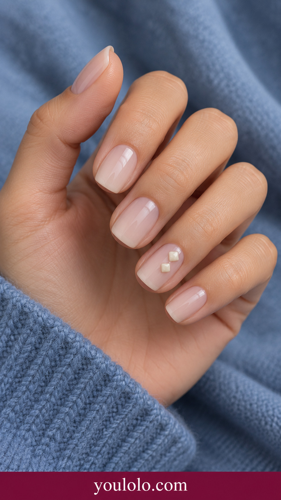 Cream Mini Cubes: short soft square sheer beige nails ring nail two tiny low profile ivory gel cubes diagonally spaced on a naturally posed adult hand