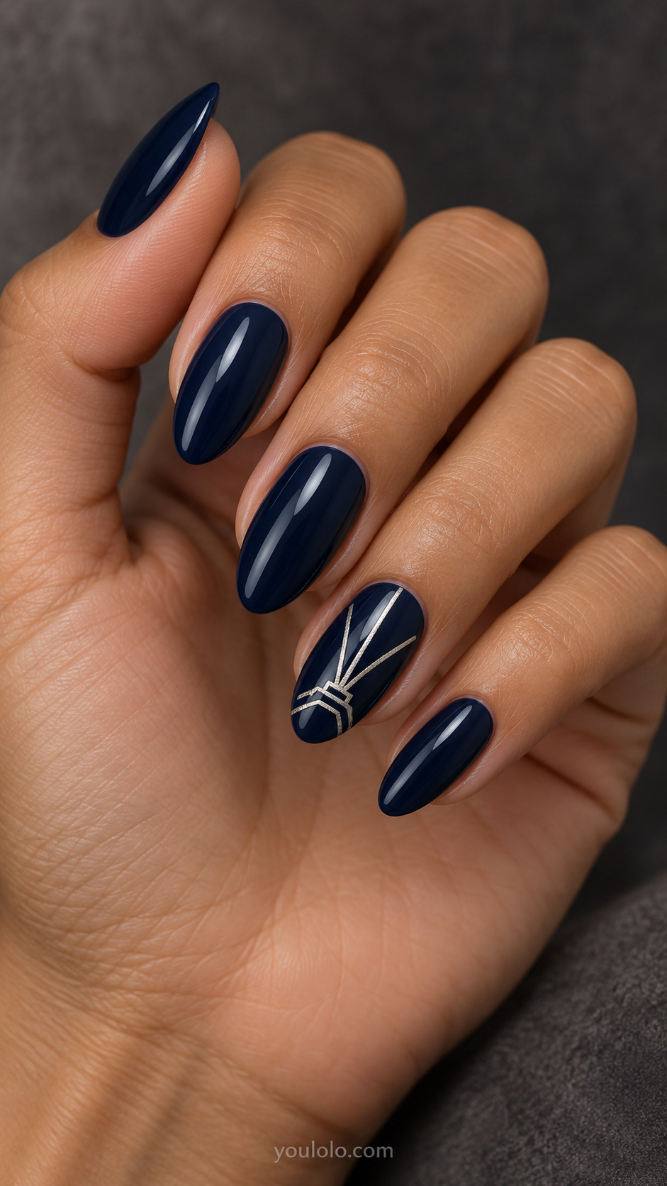 Art Deco Silver Fan on a naturally posed hand, showing dark blue polish and detailed nail art