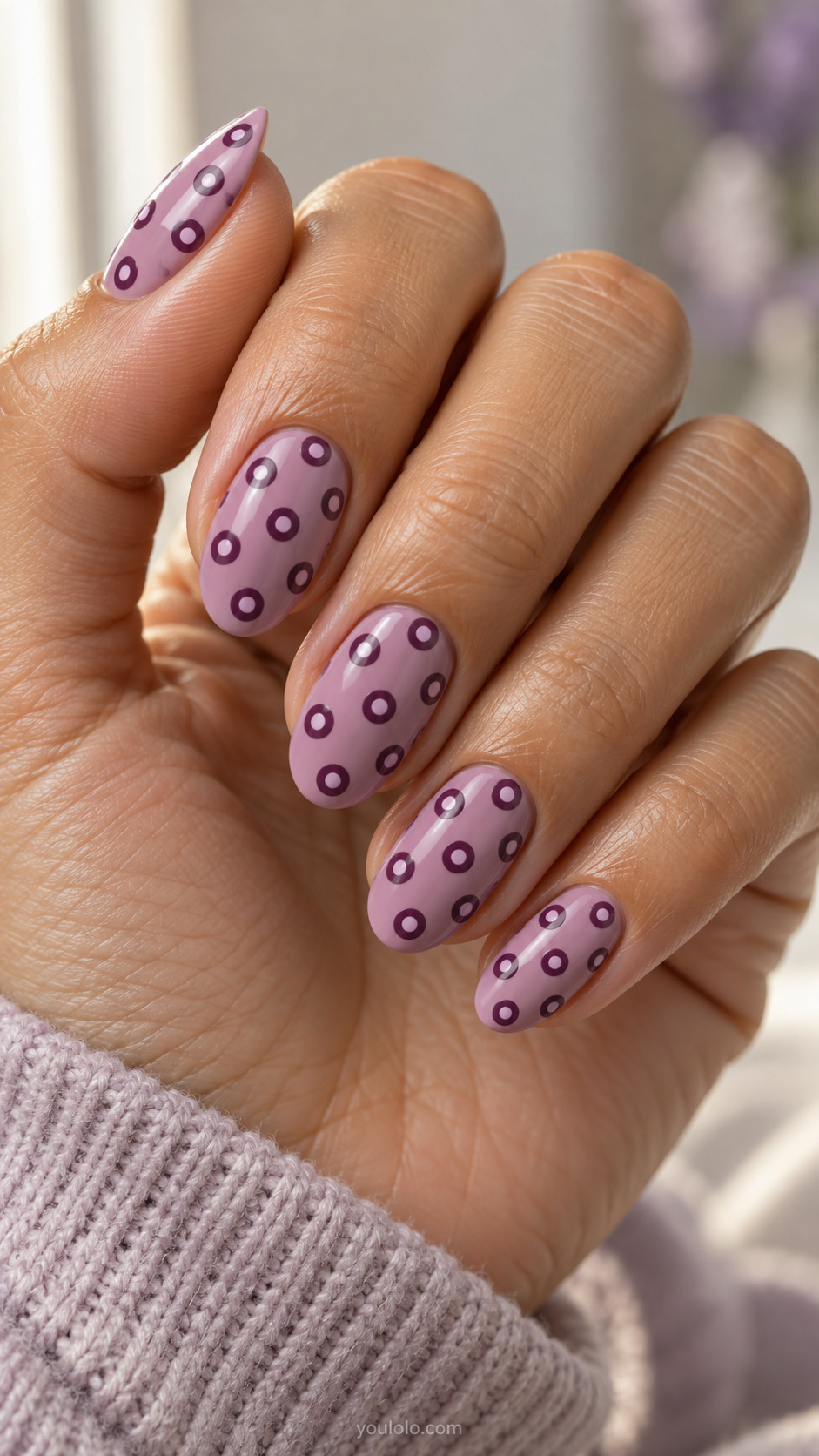 Orchid oval nails with plum circles containing smaller lilac centers.
