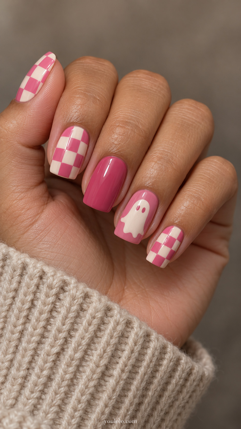 Pink square nails combining cream checkerboard and a white ghost accent