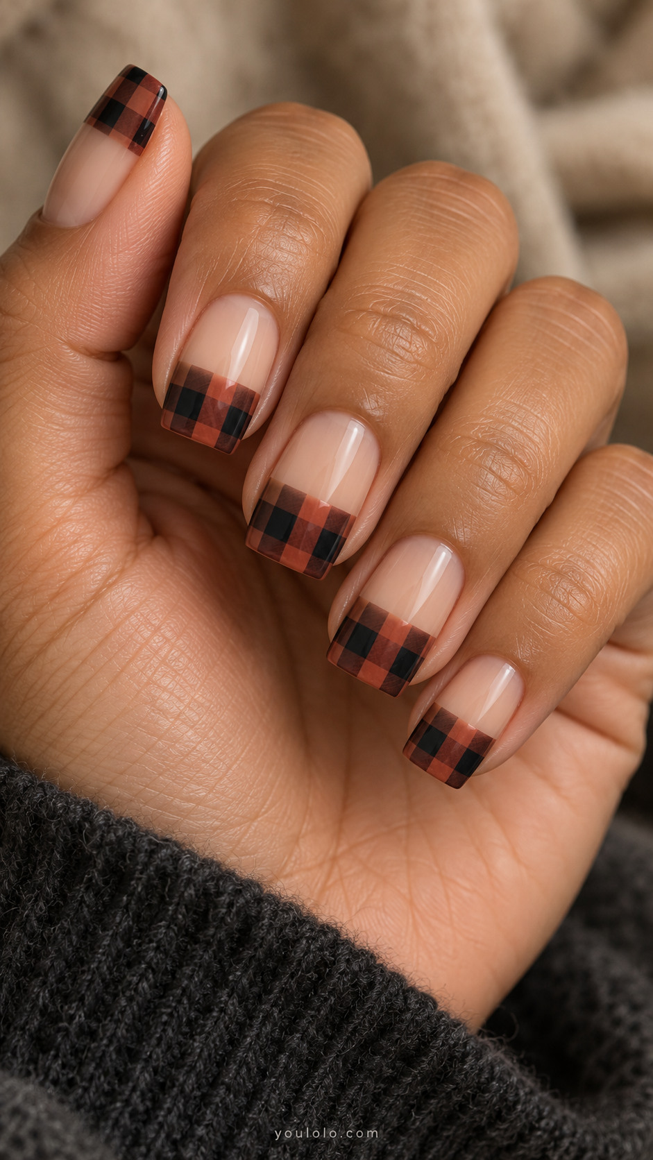 Square nude nails with straight terracotta-and-black buffalo check tips