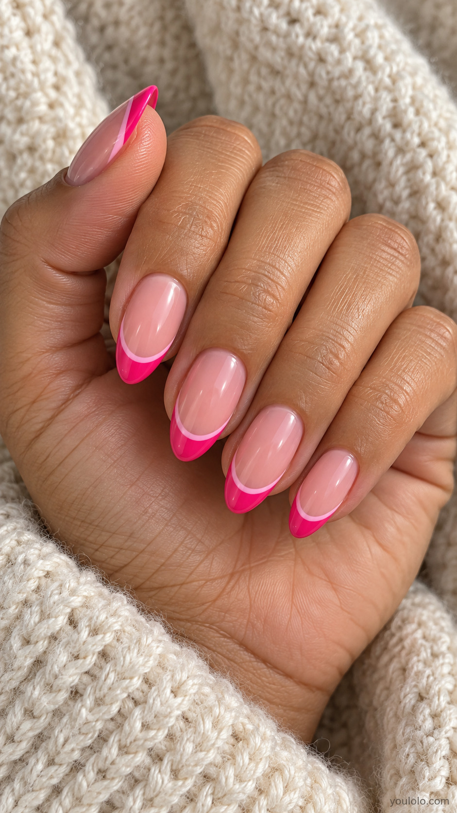 Almond nude pink nails with hot pink tips and a pale pink inner line