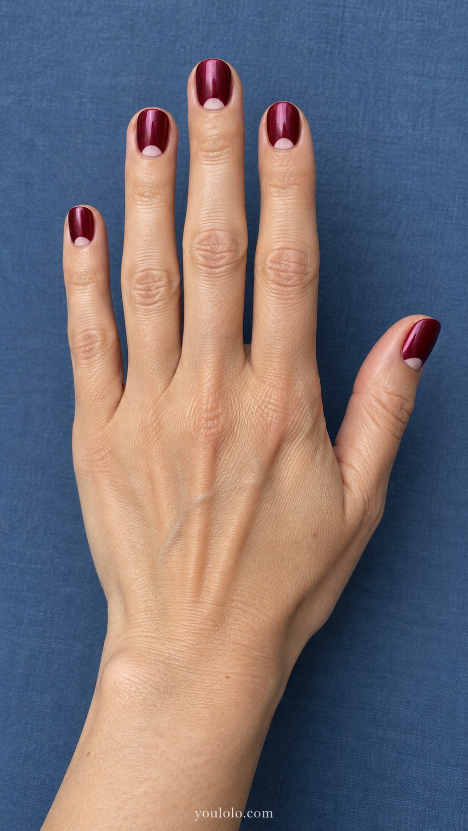 Short round burgundy pearl nails small opaque pale blush half moons