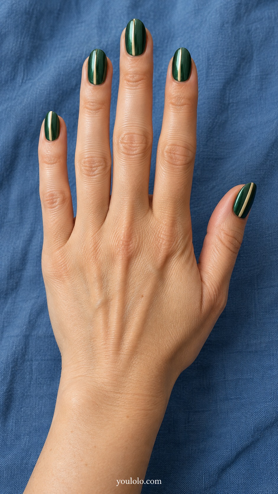 Medium oval emerald green pearl nails one fine ivory painted off-center vertical line