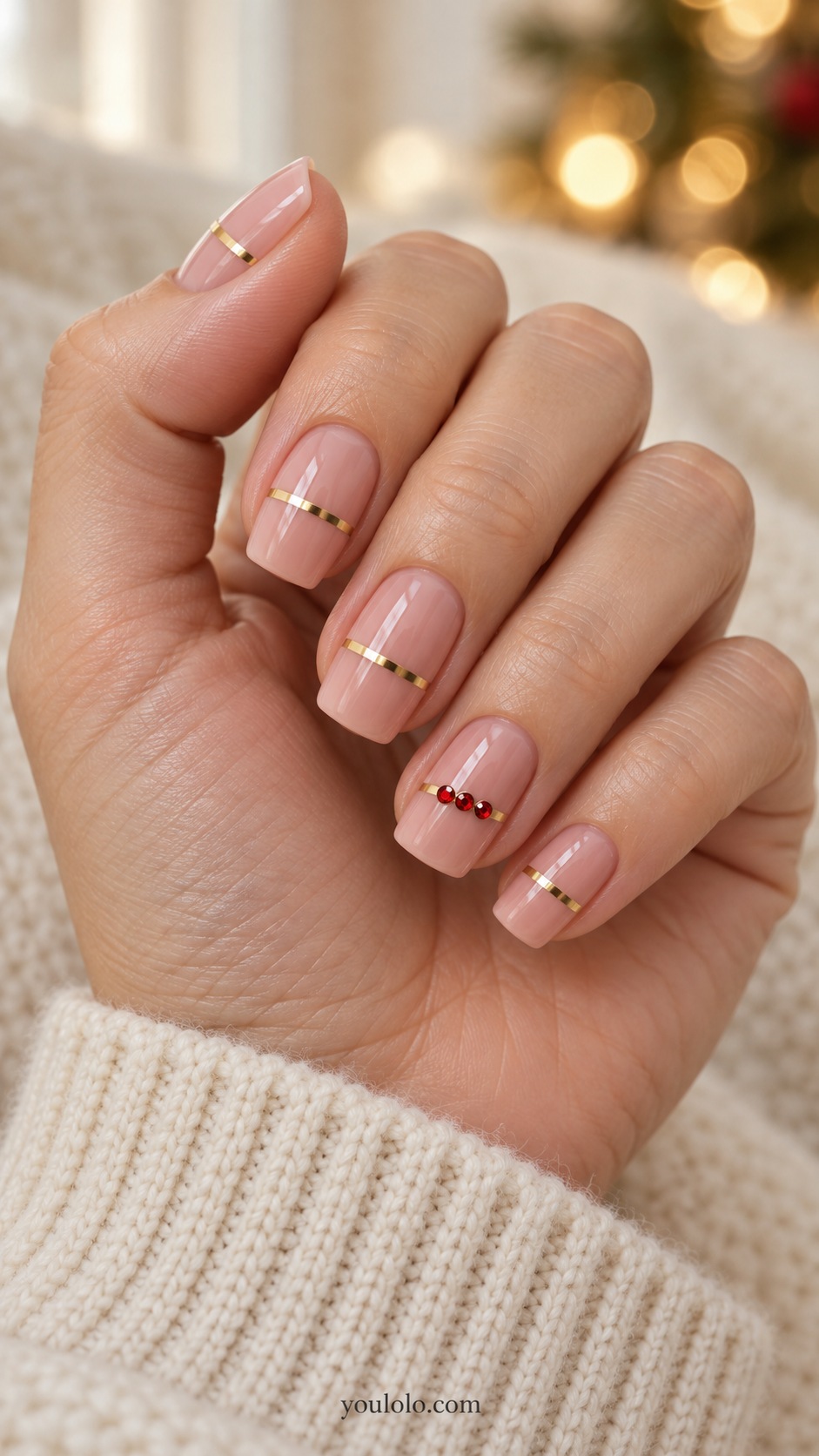 Medium square nude pink nails ring nail horizontal gold band with three tiny red rhinestones other nails one thin gold band