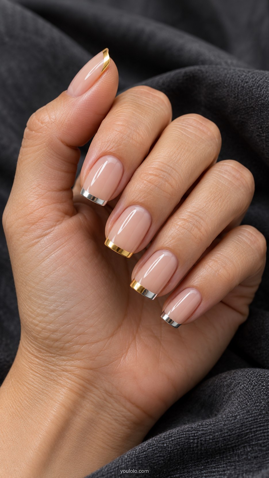 Alternating Metal Tips: medium square nude nails, alternating silver and gold thin French tips with one dual-metal tip