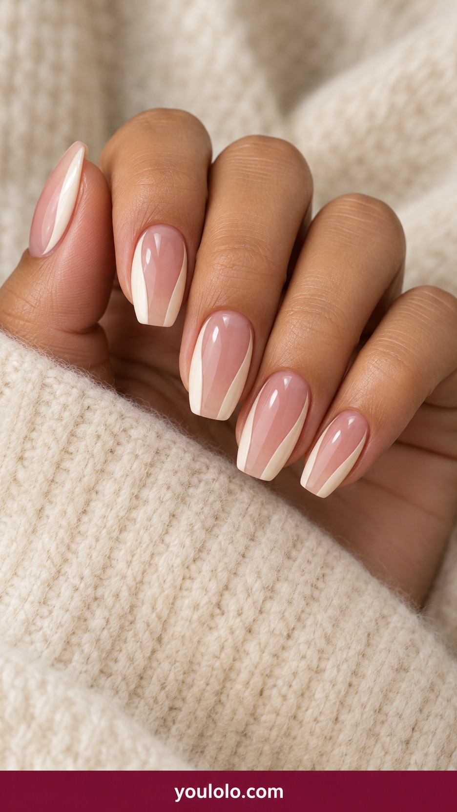 Medium square nails translucent blush with thin opaque ivory curved side panels leaving large glassy central windows on a naturally curled young adult hand