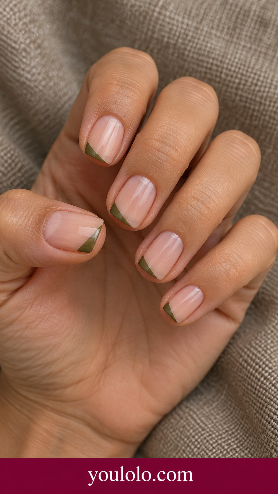 Olive Triangle Tip: short squoval sheer nude nails small olive triangular corner at tip on each nail on a naturally posed adult hand