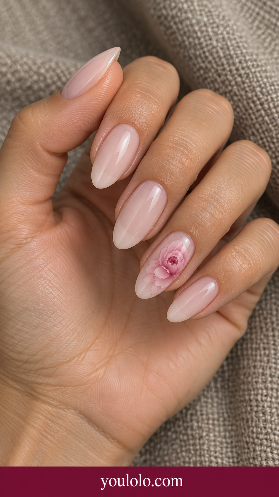 Peony Halo: medium almond translucent nude nails ring nail softly blooming pale pink peony petals with deeper rose center on a naturally posed adult hand