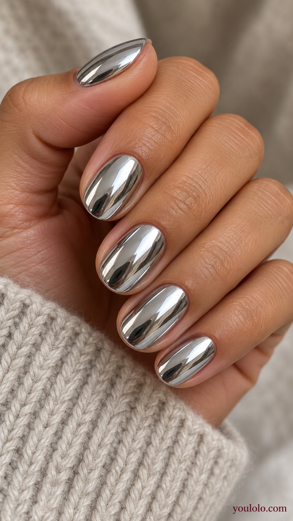 Full Silver Mirror Ovals on a naturally gathered feminine hand showing the nail finish