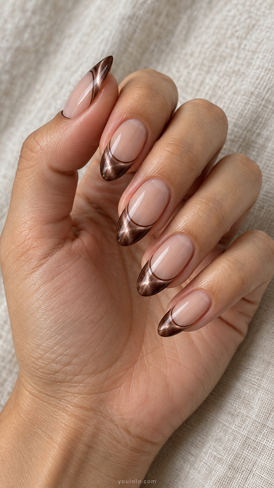 Mocha Double French cat eye nails — Medium almond sheer beige nails with brown magnetic French tips plus thin separate espresso smile line below.