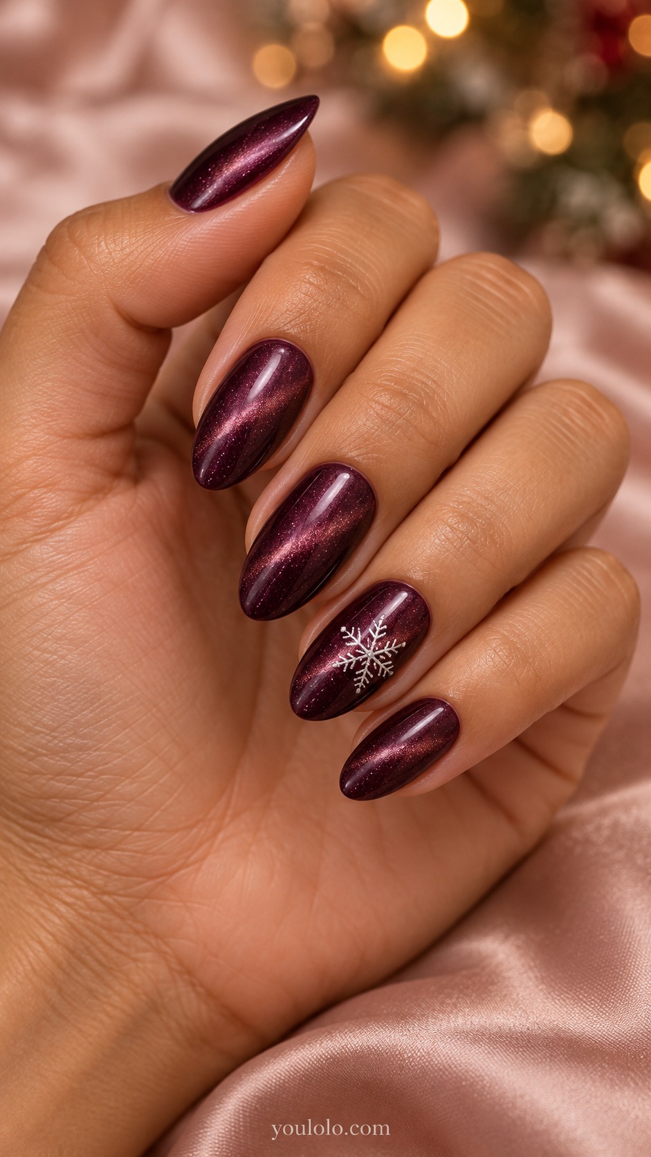 Medium almond deep plum magnetic nails one ring nail tiny white six branched snowflake