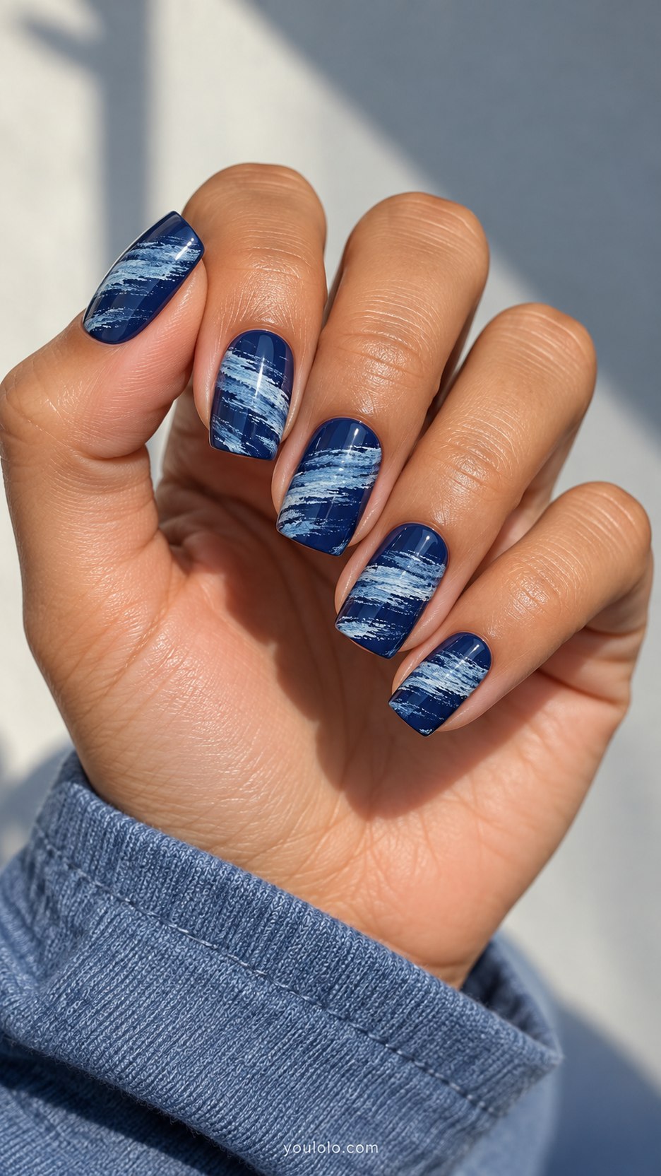 Distressed Denim Stripes: medium square indigo nails, painted horizontal pale blue wispy distressed fabric streaks, smooth surface