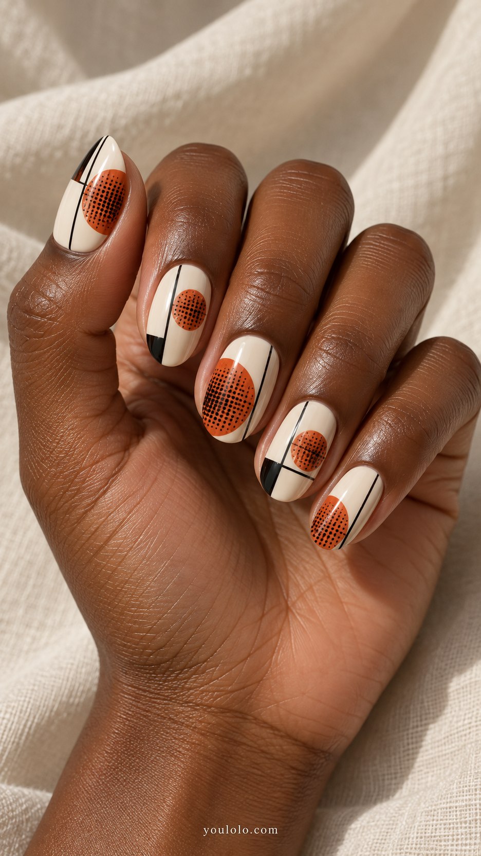Retro Orange Dots: medium oval cream nails, burnt orange halftone circles and black framed geometric panels
