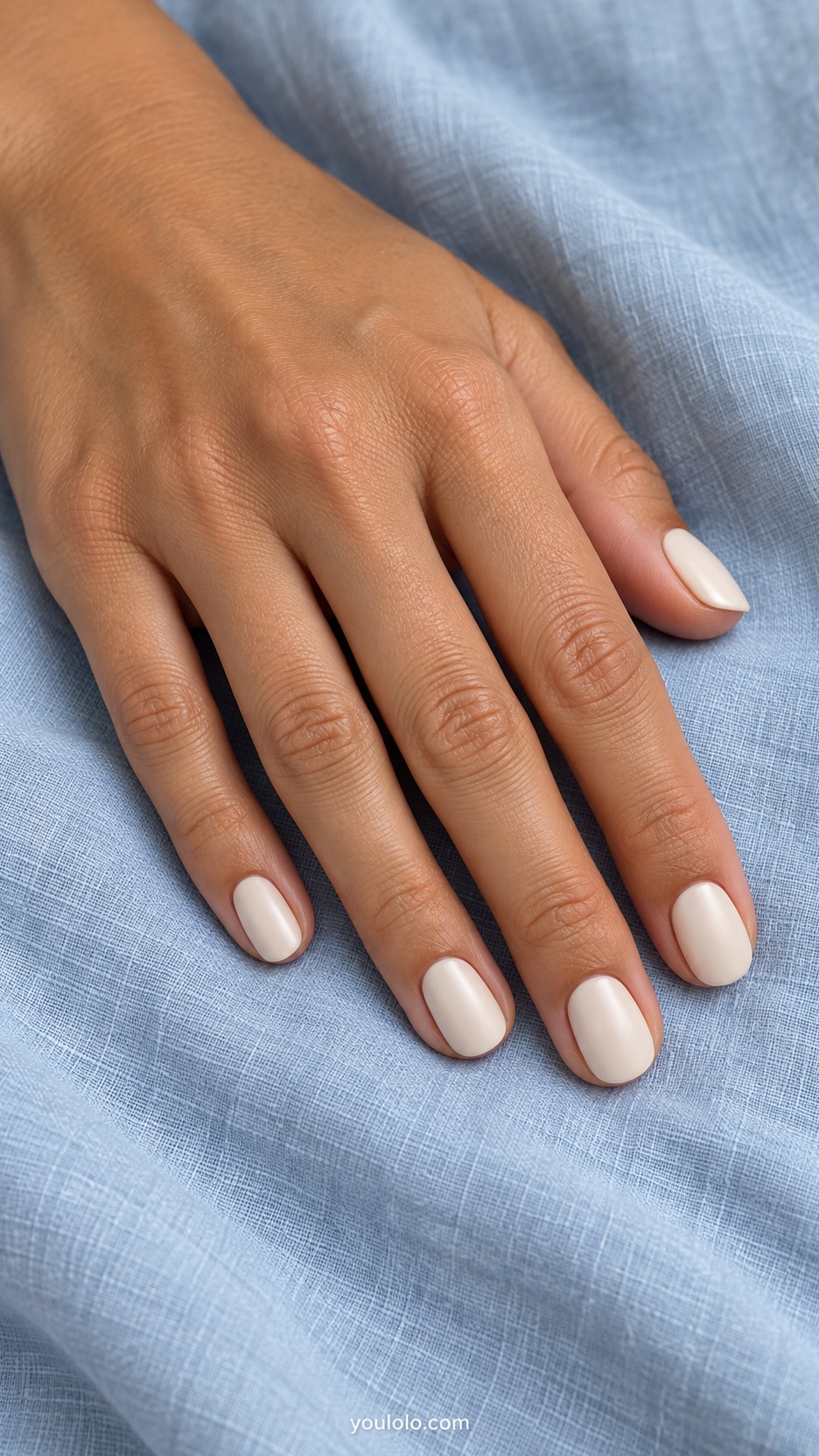 Short Wedding Nails: Satin Ivory manicure on a naturally posed hand