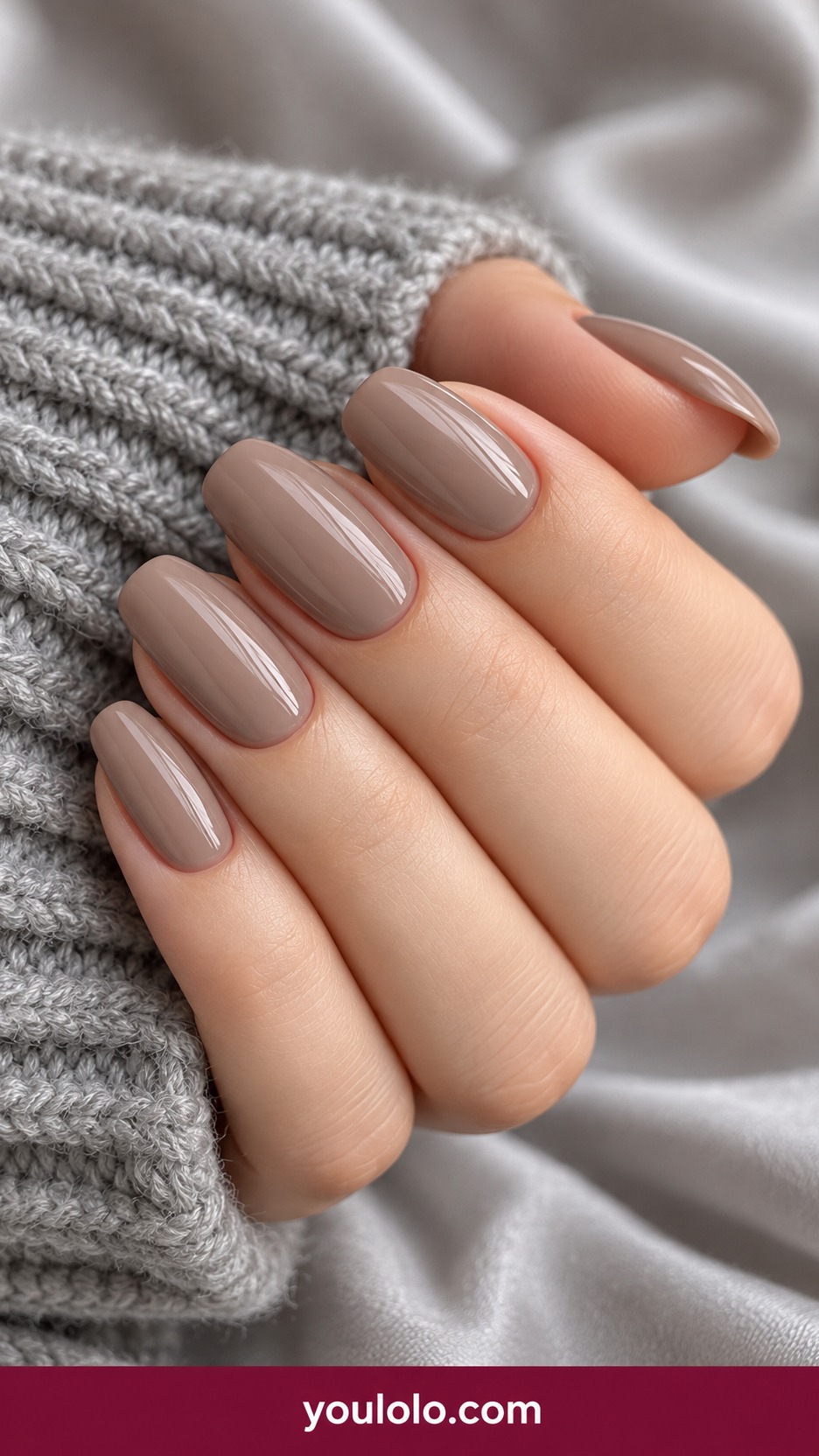 Medium soft square warm light taupe beige nails glossy plain on a naturally curled young adult hand