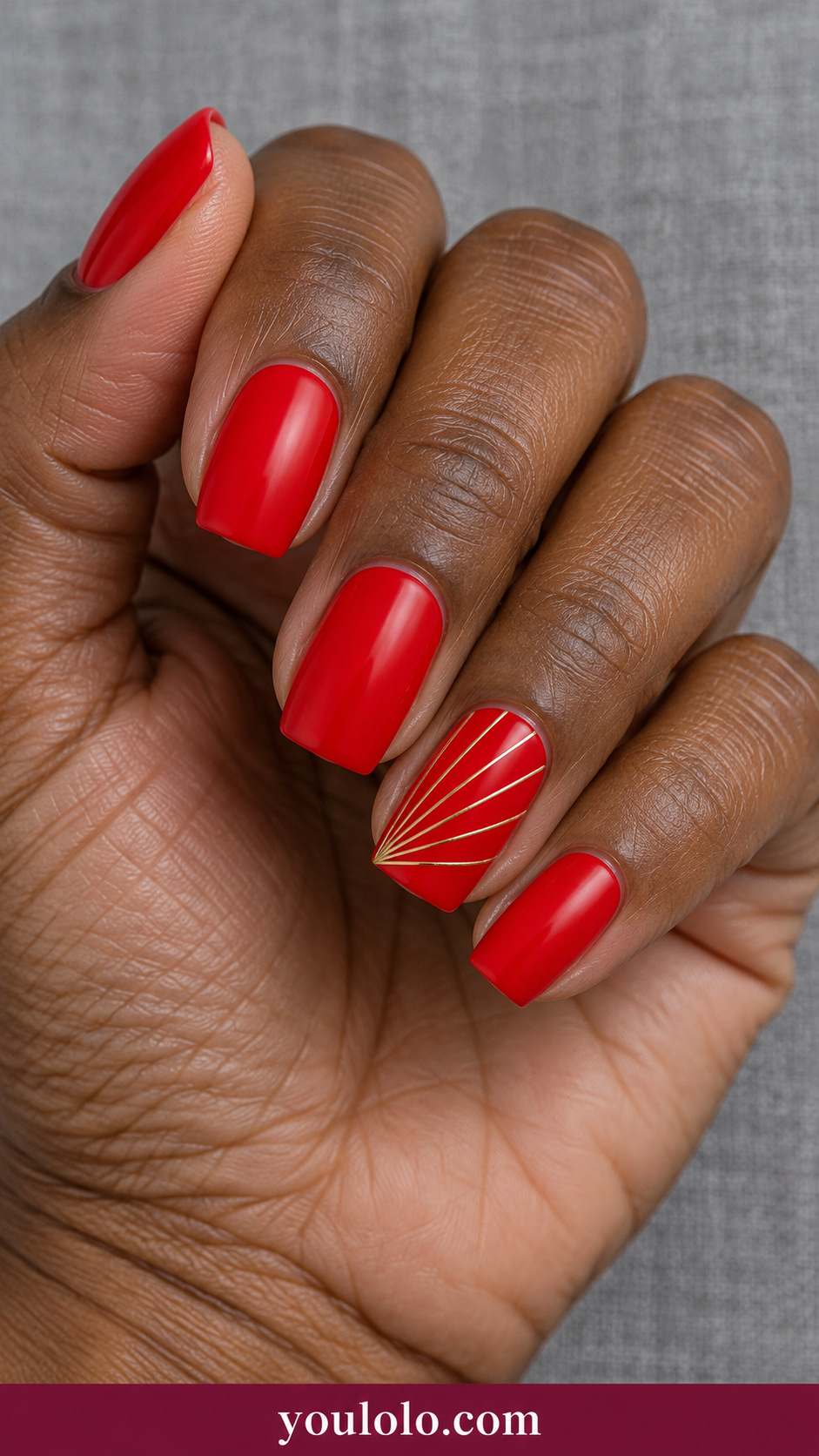 medium soft square bright scarlet nails with ONLY seven perfectly straight thin gold lines radiating geometrically from one lower corner of ring nail, straight abstract geometric fan, no curves, no leaves, no flowers, no botanicals on a naturally relaxed adult hand