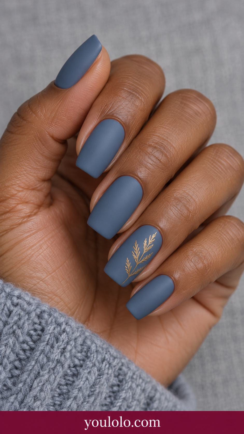 medium soft square slate blue matte nails one accent fine muted gold cedar twig on ring nail on a naturally relaxed adult hand
