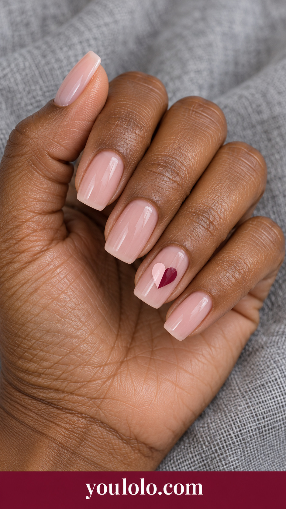 Two Tone Heart Split: medium soft square sheer pink nails one accent heart split vertically pale rose and burgundy on a naturally posed adult hand