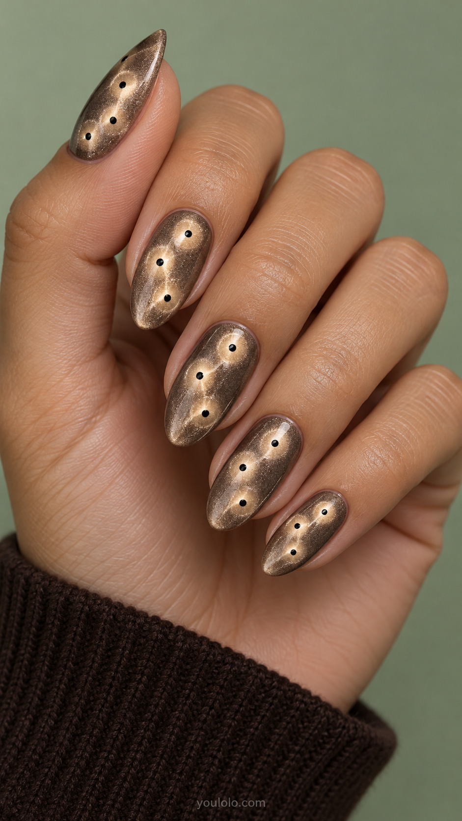 Champagne Halos With Black Dot Centers manicure on medium almond.