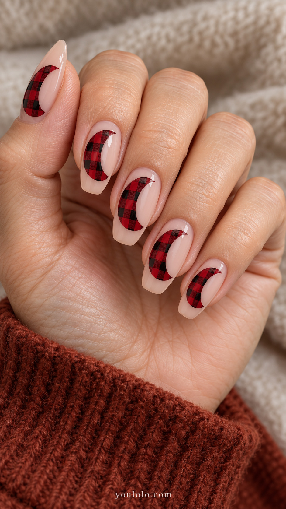 Nude tapered square nails with red-and-black buffalo check crescent shapes
