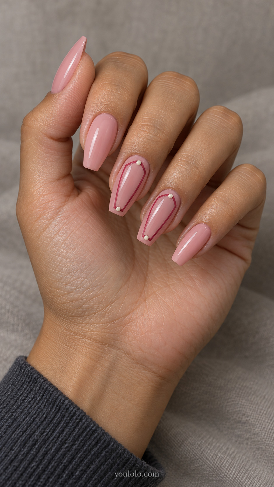 Pink coffin nails with raspberry coffin-shaped frames and ivory dots