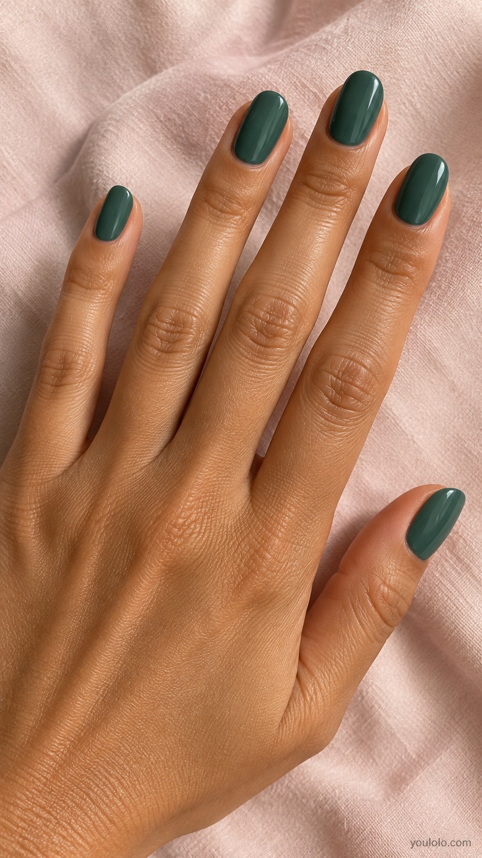 Medium oval nails muted warm green leaning petrol blue cream gloss