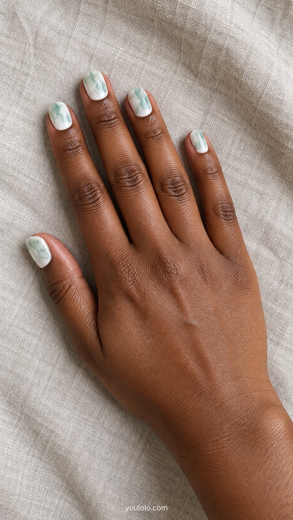 Short squoval nails milky white with translucent seafoam green irregular watercolor patches