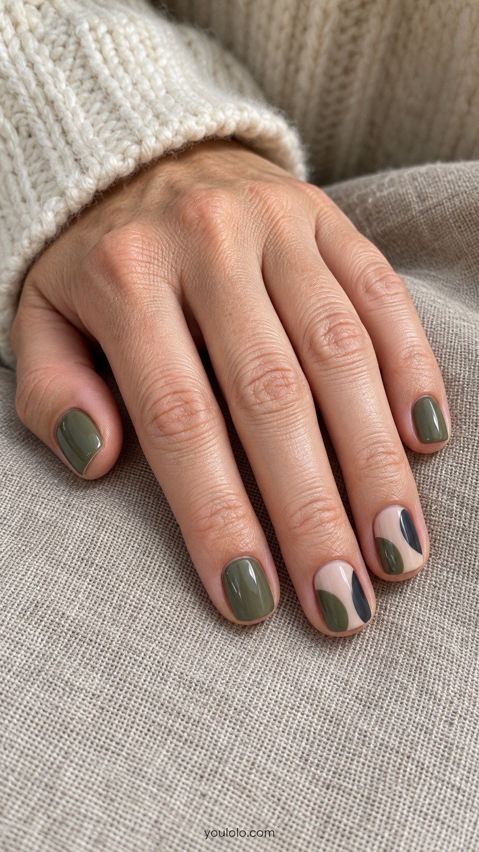 Short Artsy Nails: Olive Collage Blocks manicure on a naturally posed hand