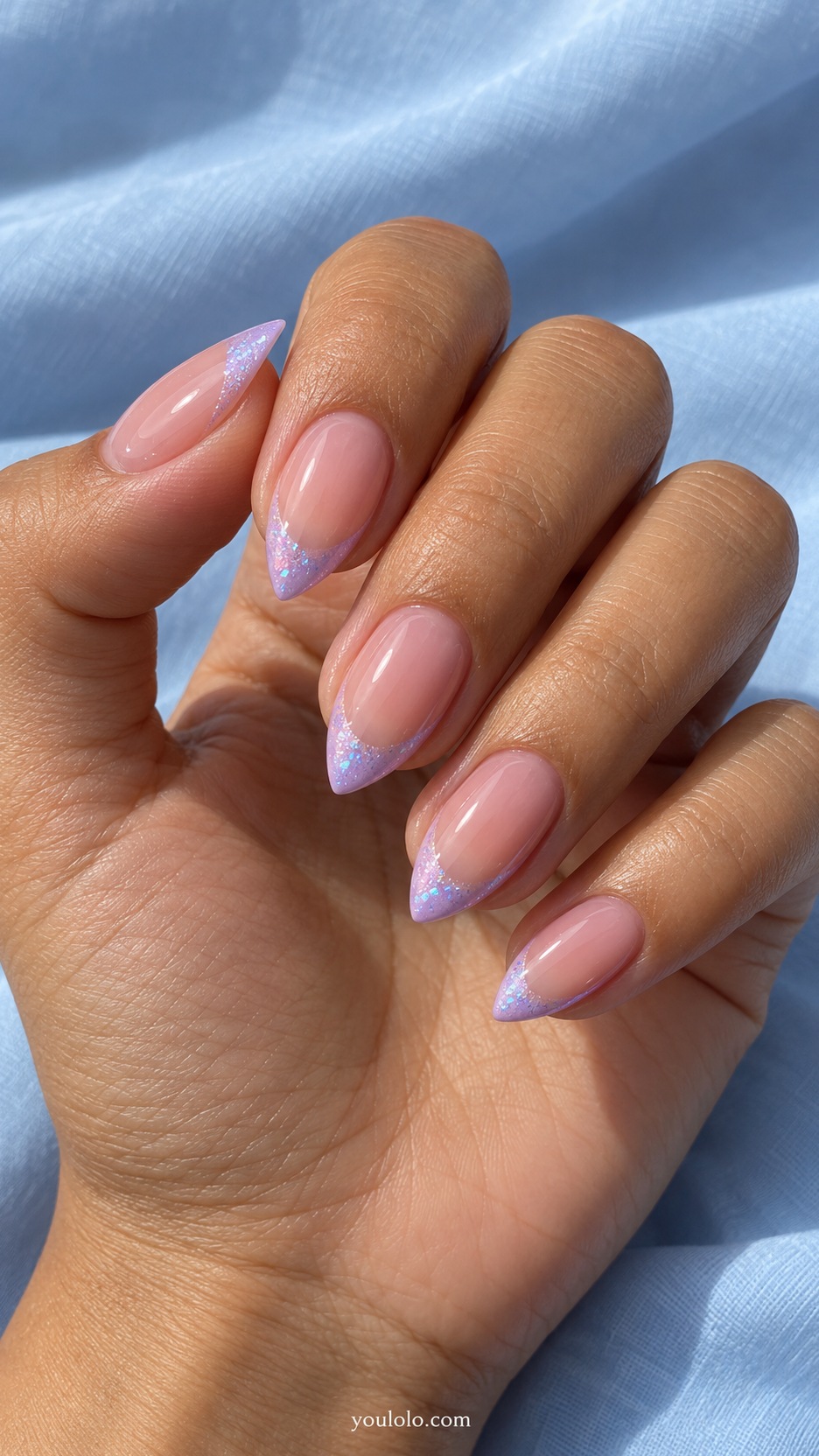 Short Stiletto French Nails: Lilac Ice French manicure on a naturally posed hand